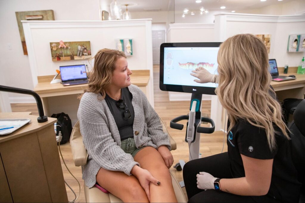 Patient reviewing orthodontic results with orthodontist in Fairhope AL