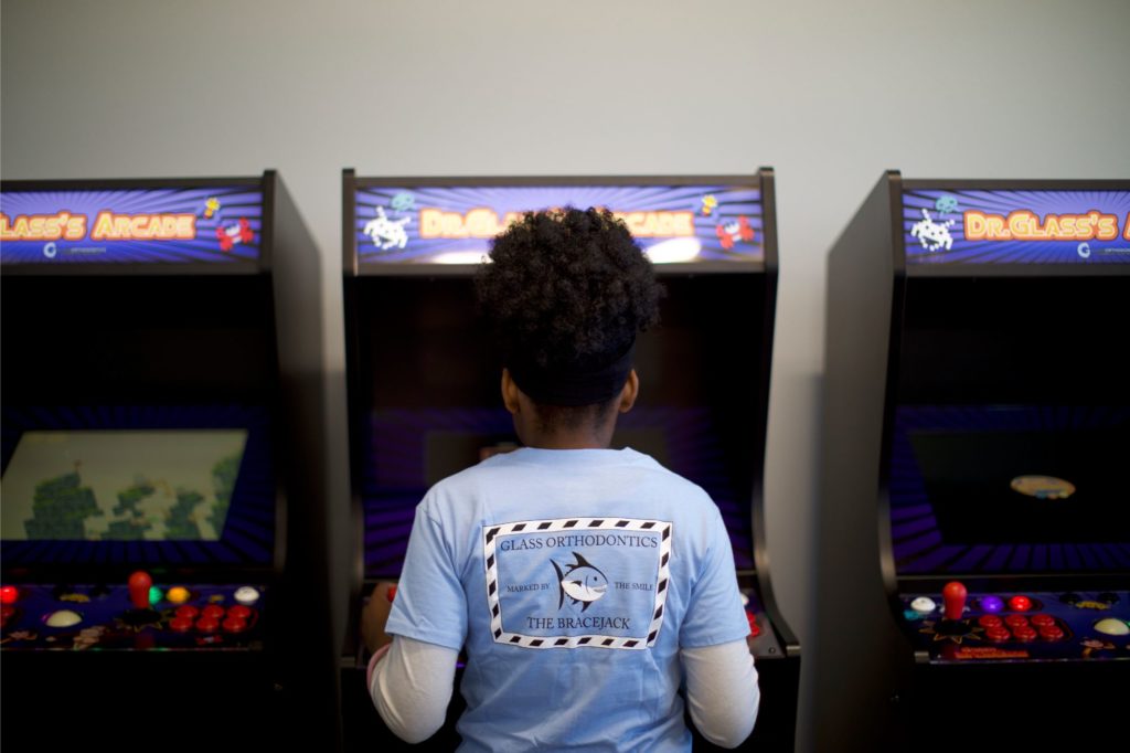 Patient playing an arcade game