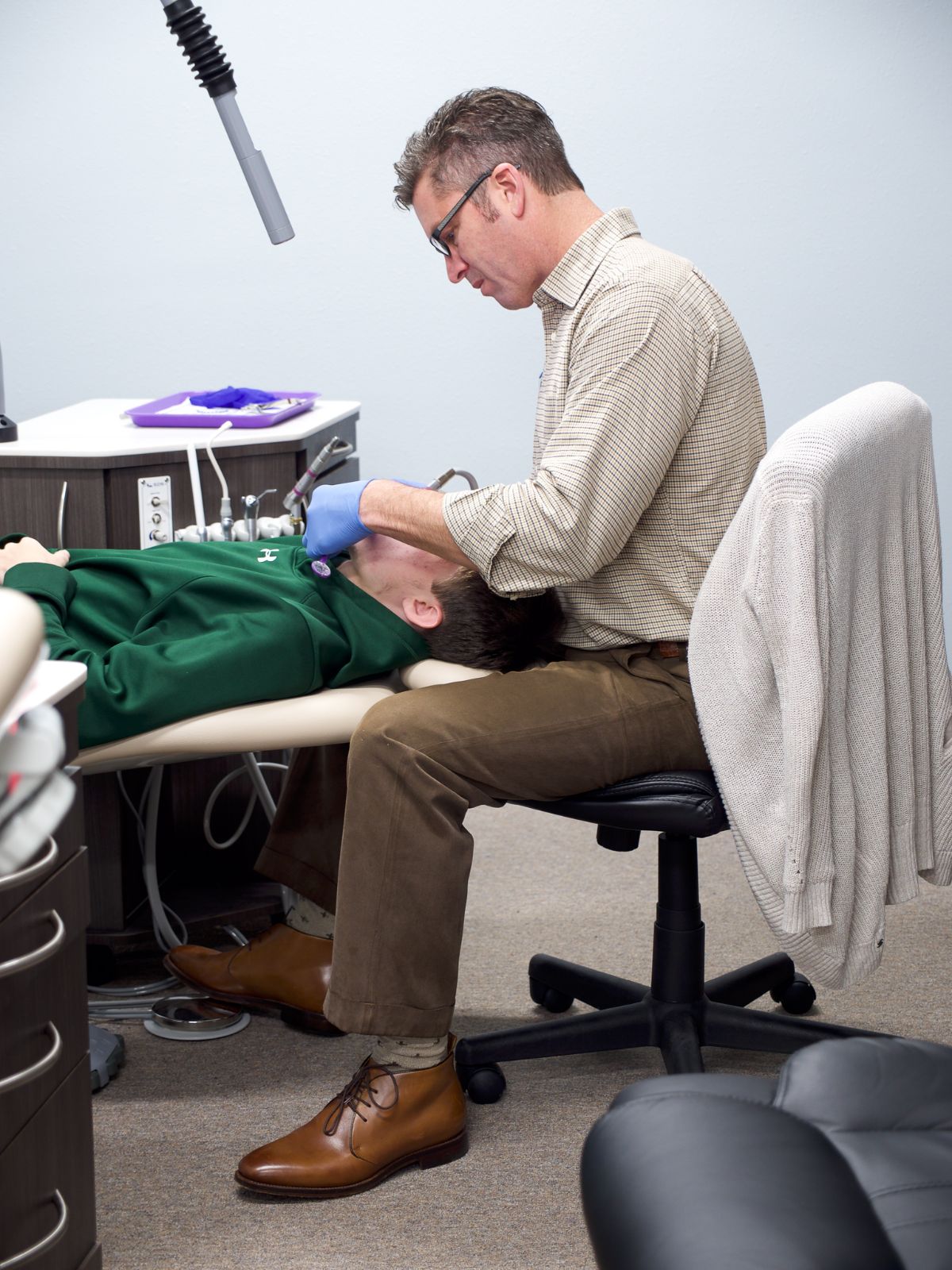 Dr. Glass working on a patient's teeth