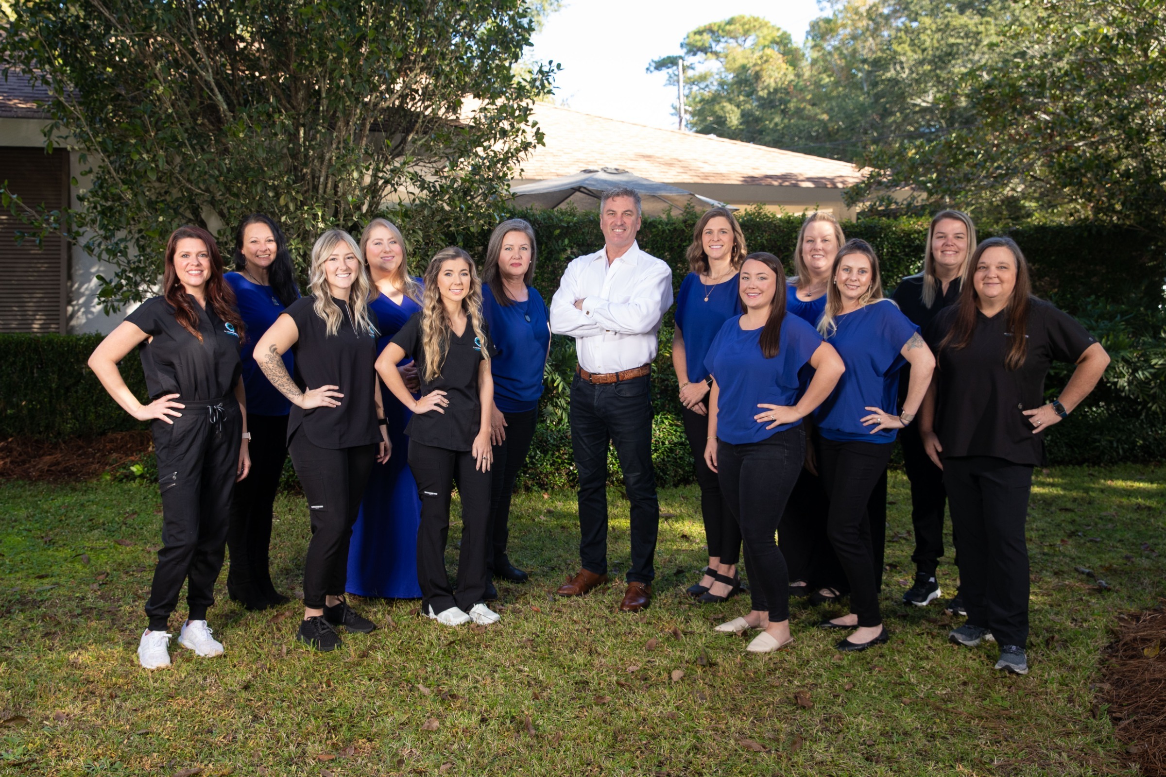 Orthodontic team at Glass Orthodontics in Fairhope AL smiling together in office